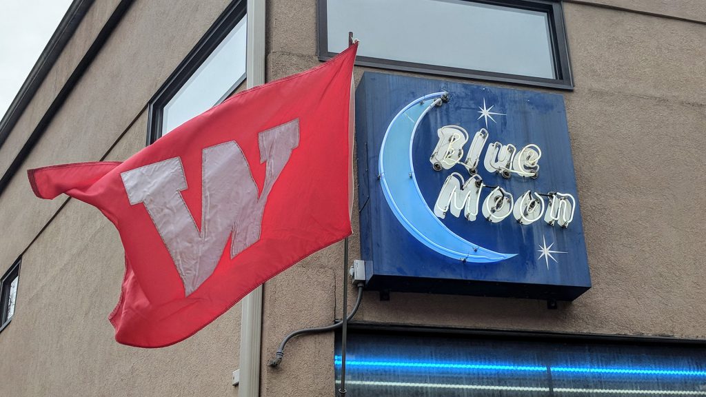 blue moon bar and grill sign